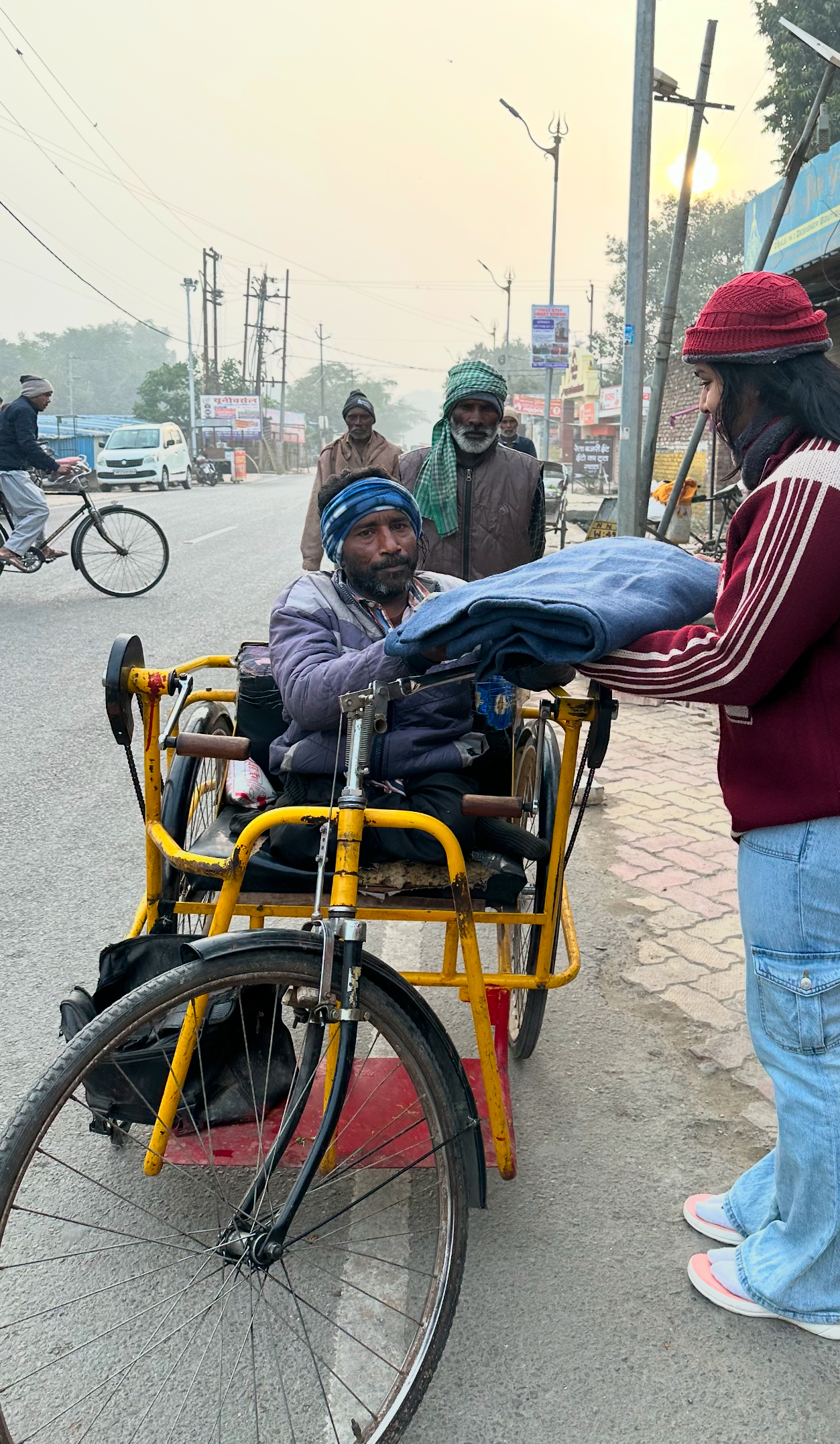 Volunteers distributing blankets to families in India Image #1